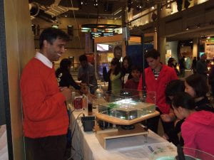 Visitors check the surface parabola at the Boston Museum of Science